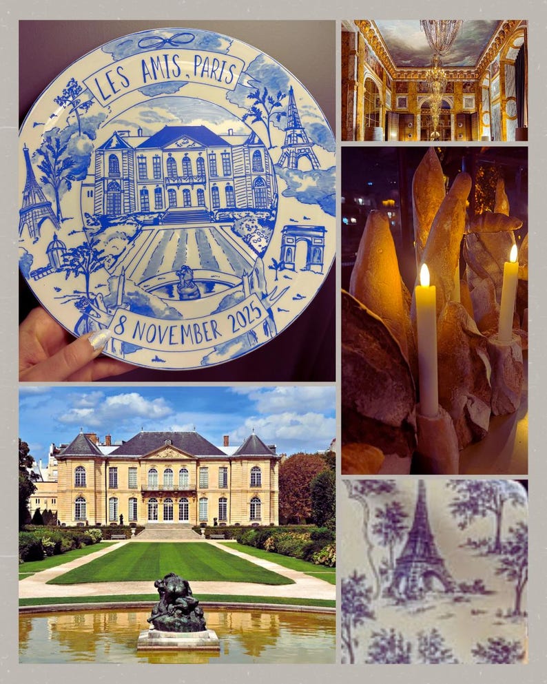 May include: A round white ceramic plate featuring blue illustrations of a French mansion, the Eiffel Tower, and the Arc de Triomphe. The text LES AMIS, PARIS is at the top, and 8 NOVEMBER 2025 is at the bottom, framed by a decorative blue border.