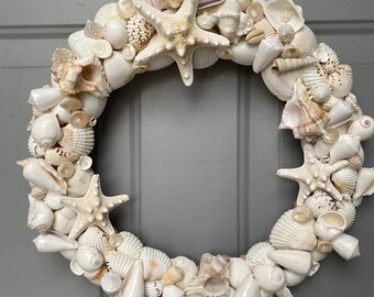 16” Beautiful white real sea shell wreath wall hanger Perfect for coastal nautical theme with several large starfish
