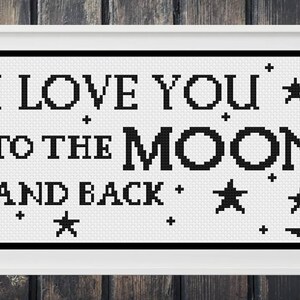 May include: Black and white cross-stitch pattern with the text "I LOVE YOU TO THE MOON AND BACK" and a crescent moon with stars.