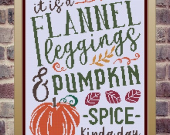 May include: Cross-stitch pattern featuring a pumpkin, leaves, and the text "it is a flannel leggings & pumpkin spice kinda day".