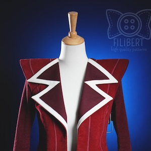 May include: A red blazer with white piping on the collar and shoulders. The blazer has a pointed collar and a single button closure. The blazer is on a white mannequin against a blue background.
