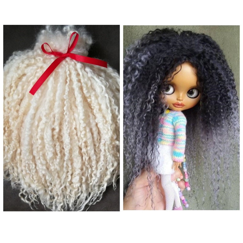 May include: A side-by-side view showing a bundle of off-white curly doll hair tied with a red ribbon on the left, and a doll with long, curly, dark gray and black hair wearing a pastel striped sweater and white skirt on the right.