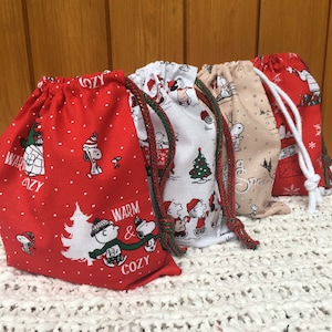 Fabulous Snoopy Christmas gift bags. 100% cotton. Choice of size and fabric. Reusable and sustainable. UK handmade.
