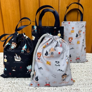 Handmade ‘Pirates Ahoy!’ party/gift bags. Fabulous keepsakes. Choice of size, colour and style. Sustainable, washable 100% cotton. UK made.