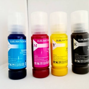 May include: Four bottles of sublimation ink, labeled C, M, Y, and K. The bottles are clear with black caps and contain blue, magenta, yellow, and black ink.