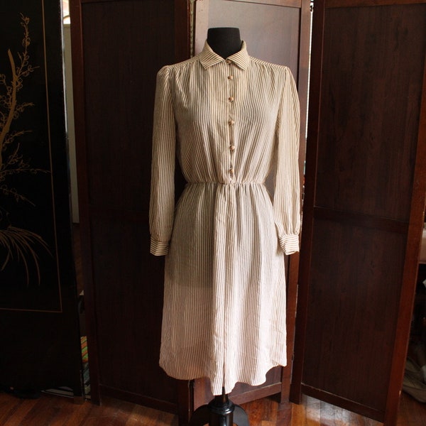 1970s vintage long sleeved shirt dress with elastic a line waist and button up front below the knees secretary day dress Malouf of dallas