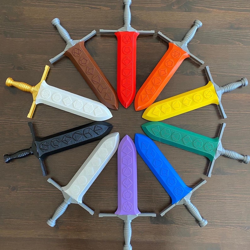 May include: Ten decorative swords with a metallic finish and a variety of colors, including red, blue, yellow, black, and white. Each sword has a different design featuring a dice symbol.