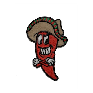 May include: Red chili pepper cartoon character wearing a brown sombrero with green and red trim. The chili pepper has a smiling face with white teeth and is holding its arms crossed.