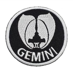 May include: A black and white embroidered patch with the Gemini logo and the text "GEMINI" in white.
