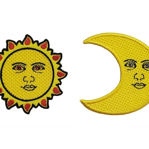 May include: Embroidered patches featuring a smiling sun with red and yellow details and a crescent moon with a smiling face. The patches are yellow with black outlines and are likely for clothing or accessories.
