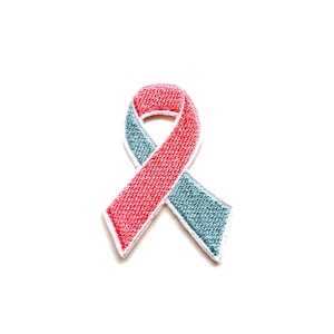 May include: A red and blue ribbon, a symbol of awareness and support.