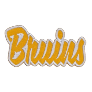 May include: A yellow embroidered patch with the word "Bruins" in white lettering.