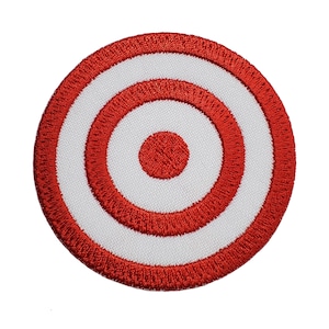 May include: Red and white embroidered target patch with three concentric circles.