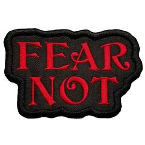 May include: Black embroidered patch with red lettering that reads "FEAR NOT".