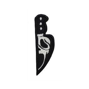 May include: Black embroidered patch of a knife with a white skull design.