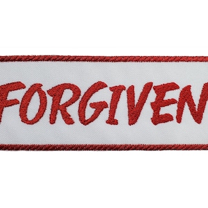 May include: Red embroidered patch with a white background and the word "FORGIVEN" in red lettering.