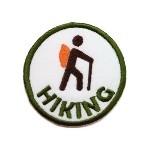 May include: Green and white embroidered patch with a hiker silhouette and the word "HIKING" in green.