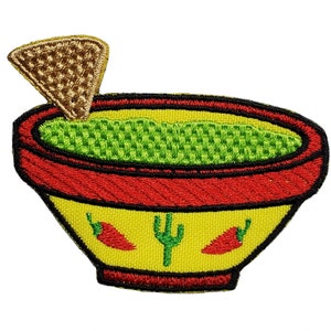 May include: Embroidered patch of a yellow bowl filled with green guacamole and a brown tortilla chip on top. The bowl has red trim and two red chili peppers and a green cactus on the side.