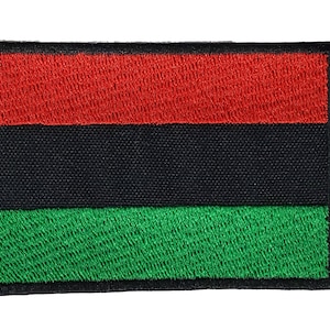 May include: Embroidered rectangular patch with a horizontal tricolour design. The top stripe is red, the middle is black, and the bottom is green. The patch has a black border and a textured appearance.