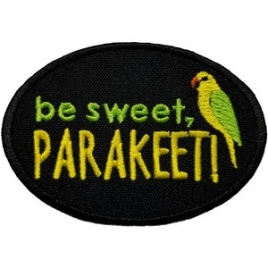 May include: Black oval embroidered patch with yellow and green text that reads "be sweet, PARakeet!" and a green and yellow parakeet illustration.
