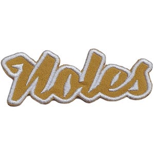 Può includere: Toppa ricamata in oro con la parola "Noles" in un font stilizzato.
