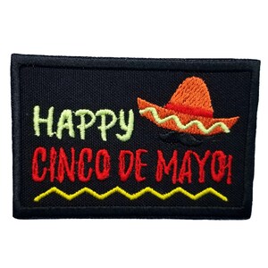 May include: Black embroidered patch with the text "Happy Cinco de Mayo" and a red and orange sombrero with yellow trim.