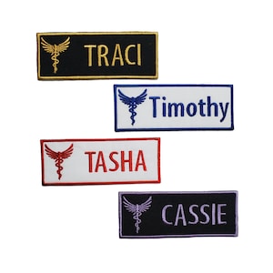 May include: Four embroidered name tags featuring a medical symbol and a name. The tags are black, white, red, and purple. The names are Traci, Timothy, Tasha, and Cassie.