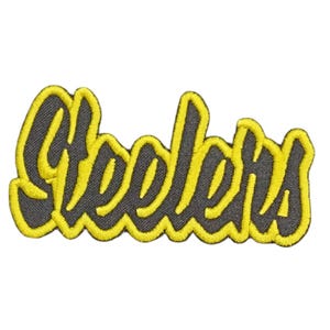 May include: A yellow and black embroidered patch with the word "Steelers" in a stylised font.
