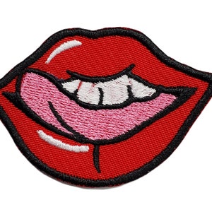 May include: Red embroidered lips with a pink tongue sticking out. The lips are outlined in black and have white teeth.