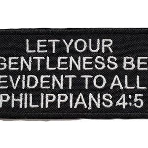 May include: Black embroidered patch with white text that reads "Let your gentleness be evident to all Philippians 4:5".