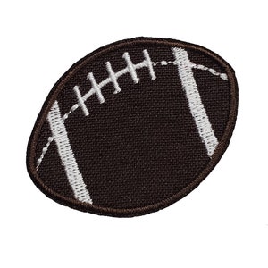 May include: A brown and white embroidered patch shaped like a football.
