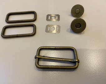 Hand bag strap hardware and Magnetic snap closure.  Antique brass metal finish.  5 piece handbag hardware set.