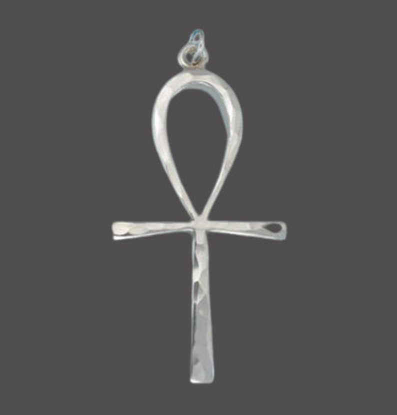 May include: Silver Ankh pendant with a hammered finish. The Ankh is an ancient Egyptian symbol of life.