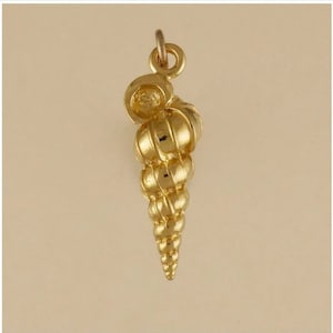 May include: A gold-colored seashell charm pendant. The seashell is detailed and has a spiral shape.
