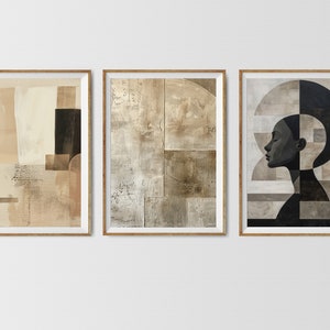 May include: Three framed abstract art prints with geometric shapes and muted colors. The left print features a beige and brown abstract design. The center print features a beige and brown abstract design. The right print features a black and white silhouette of a person's face with geometric shapes.