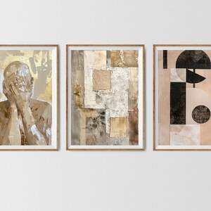 May include: Three framed abstract art prints with a neutral color palette. The first print features a nude figure with their face covered by their hands. The second print features a collage of geometric shapes in shades of brown and beige. The third print features a geometric design with black and white shapes on a beige background.