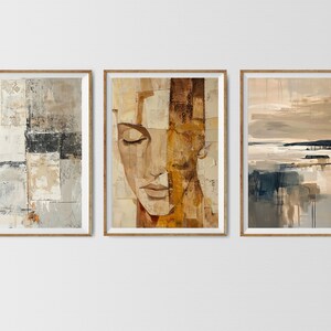 May include: Three abstract paintings in brown, beige, and gray tones. The leftmost painting features geometric shapes and textures. The center painting depicts a close-up of a woman's face. The rightmost painting shows a landscape with a horizon line and water.