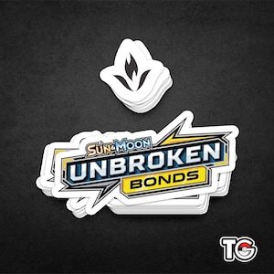 May include: A stack of white stickers with the text "Sun & Moon Unbroken Bonds" in blue, yellow, and black. The stickers have a black flame symbol on top.