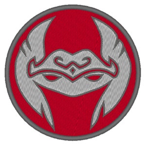 May include: A red and gray embroidered patch with a stylized face design. The face has a crown and a mask.