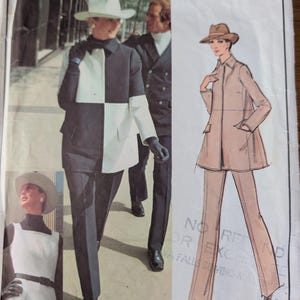 May include: A Vogue Paris Original sewing pattern envelope 2668 by Givenchy featuring illustrations of a two-tone black and white jacket and pants outfit, and a tan jacket and pants outfit, both worn with hats and gloves, with text 2668 visible.