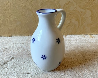 Vintage delft blue ceramic pitcher jug creamer kitchenware design floral motif vase white china small dark flowers bud side handle floristry