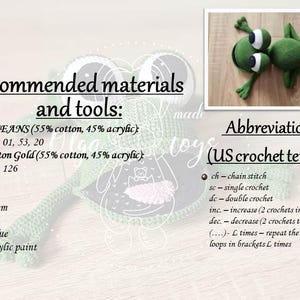 May include: Crochet pattern instructions for making a two-headed frog amigurumi toy. The pattern uses YarnArt Jeans and Alize Cotton Gold yarn in green and gold colors. The pattern includes abbreviations for US crochet terms.