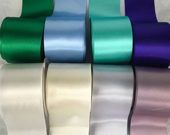 Satin ribbon wide 6.5 cm .double sided.   Sold by the meter. Green, blue, purple, white, pink....