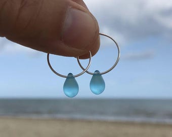 Handmade Sterling Silver hoop earrings with a aquamarine blue glass water drop. Cute / Minimal / Sea Glass / Ocean / Beach / by Nui