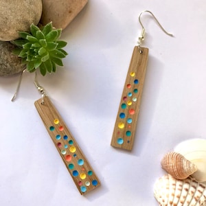 Handmade recycled wooden eco earrings, hand painted with carved multicoloured dots by Nui Jewellery