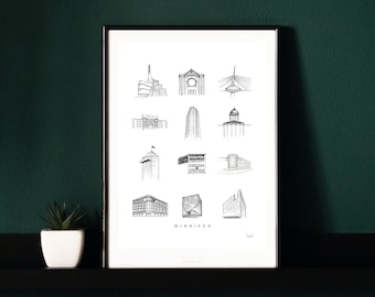May include: Black framed art print featuring detailed line drawings of Winnipeg landmarks. The print includes illustrations of various buildings and structures, with the city's name at the bottom. The artwork is displayed on a black shelf against a dark green wall.