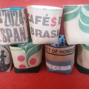 Upcycled large coffee sack plant pot covers.