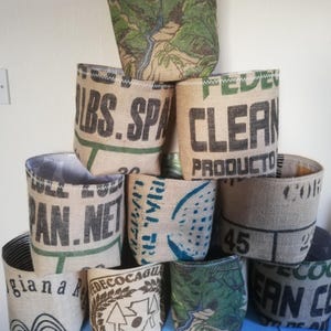 Upcycled large coffee sack plant pot covers.
