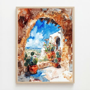 May include: Watercolor painting of a sunlit courtyard scene. A stone arch frames a view of a white building with terracotta pots of cacti and flowers. The sky is a bright blue with fluffy white clouds. The artwork is in a wooden frame.