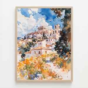 May include: Watercolor painting of a Greek landscape featuring the Acropolis. The artwork showcases white buildings with orange tile roofs, set against a backdrop of a blue sky with fluffy clouds. Yellow and orange flowers are in the foreground, framed in a light wood frame.